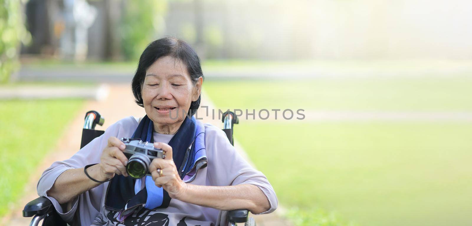 elderly woman relax with hobby in backyard by toa55