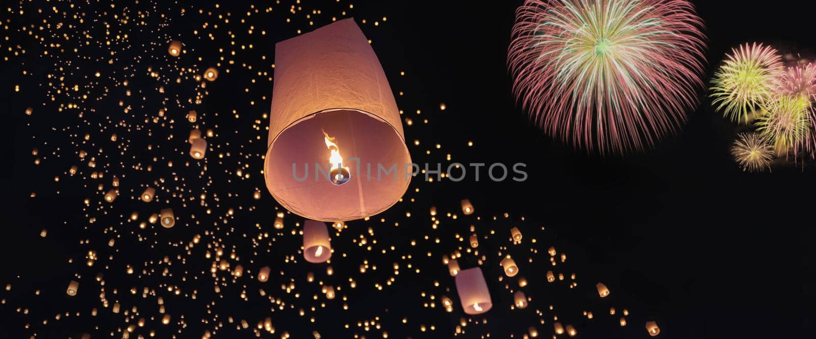 Tourist floating sky lanterns in Loy Krathong festival , Chiang Mai ,Thailand.