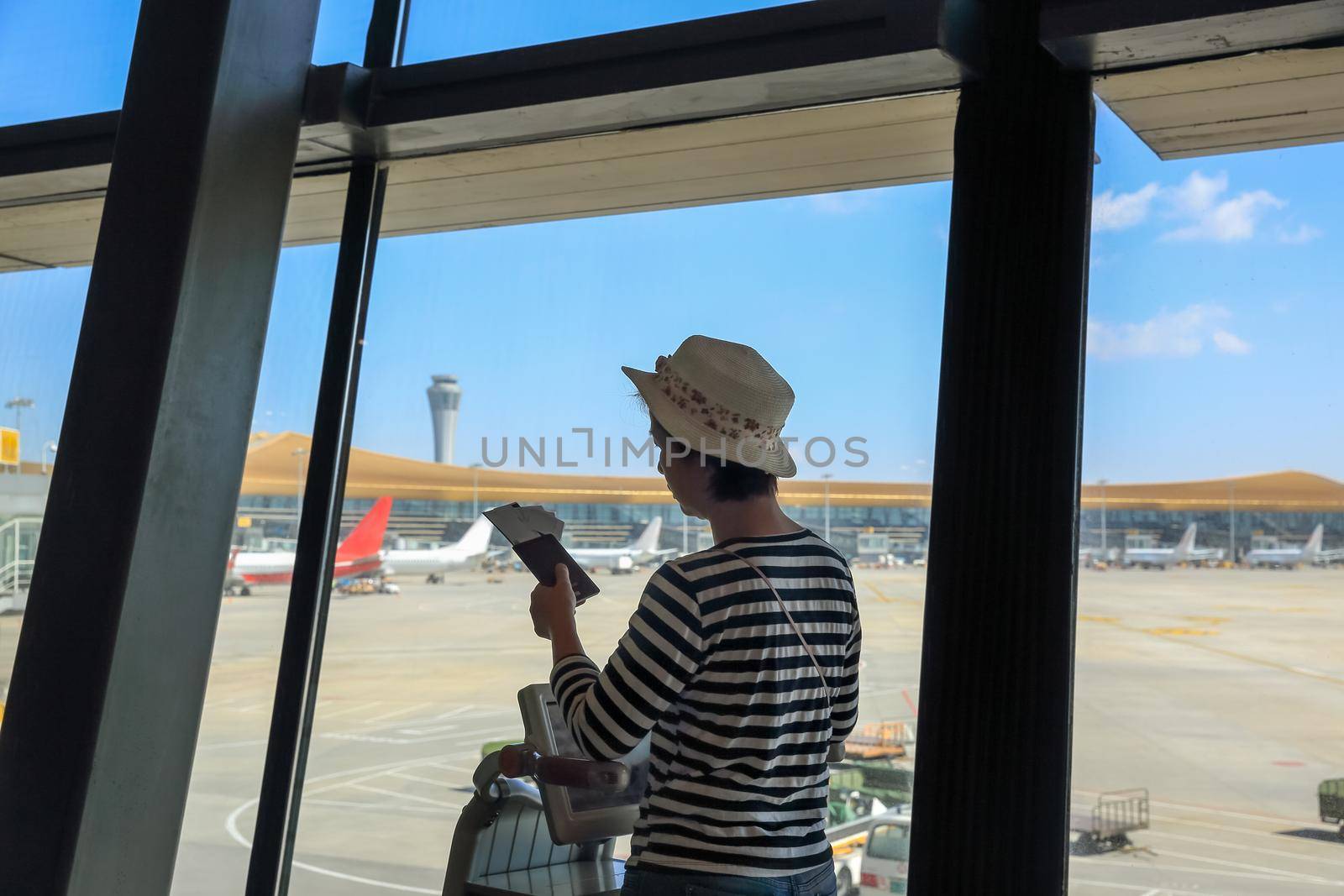 Passenger finding her boarding gate at Kunming Changshui International Airport  ,Yunnan, China. by toa55