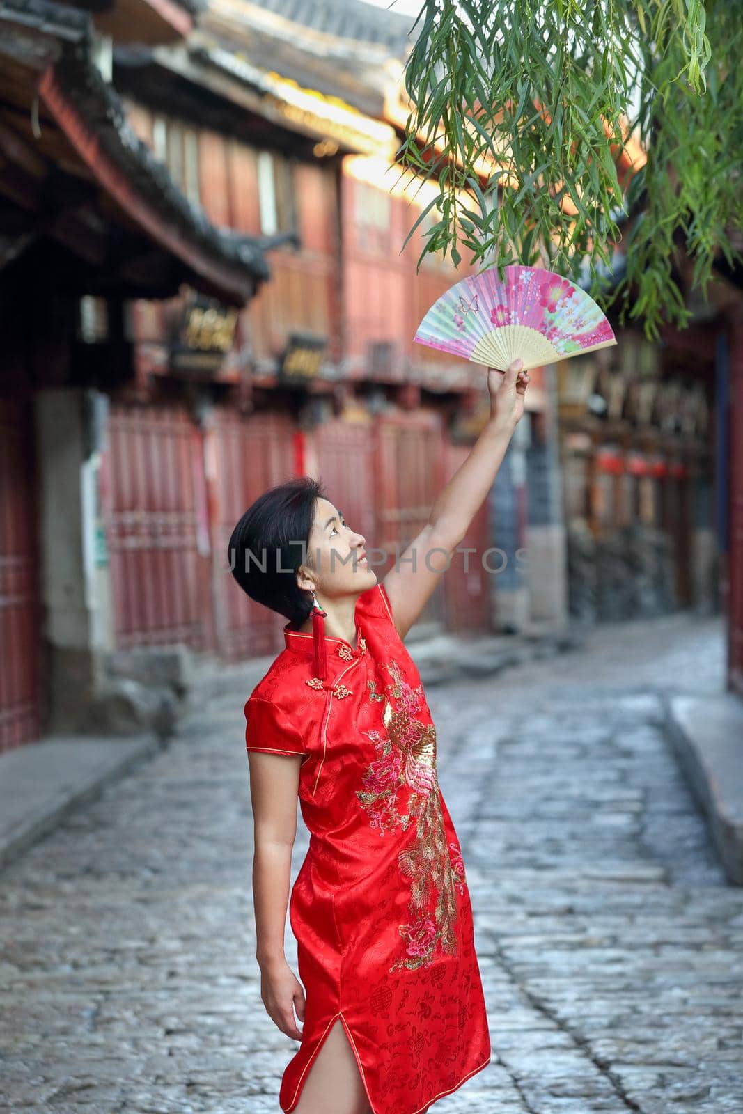 Female Tourist with Chinese Traditional Clothing in Lijiang Old town ,Yunnan, China. by toa55