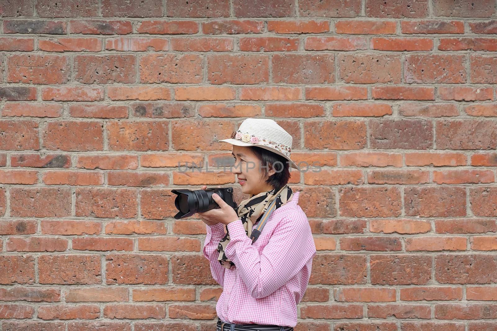 Traveler Tourist Woman Hold Photo Camera in China by toa55