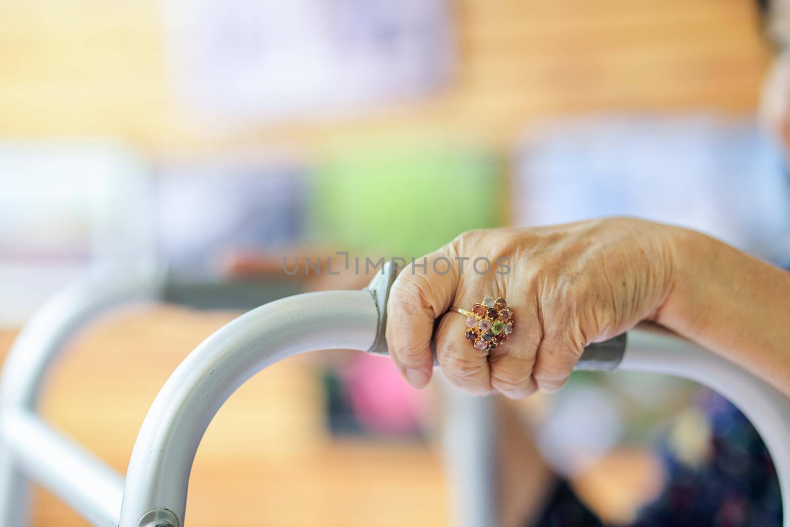 Elderly asian woman using a walker in restaurant