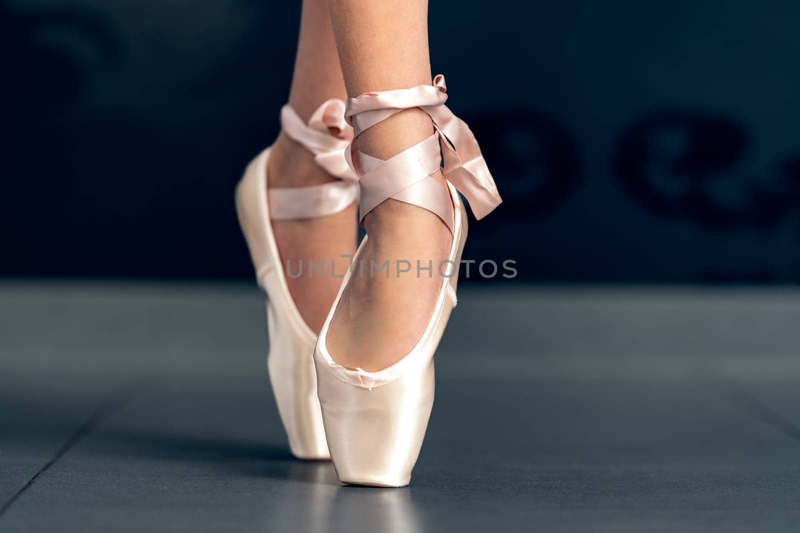 ballet shoes on the feet of a ballerina. High quality photo