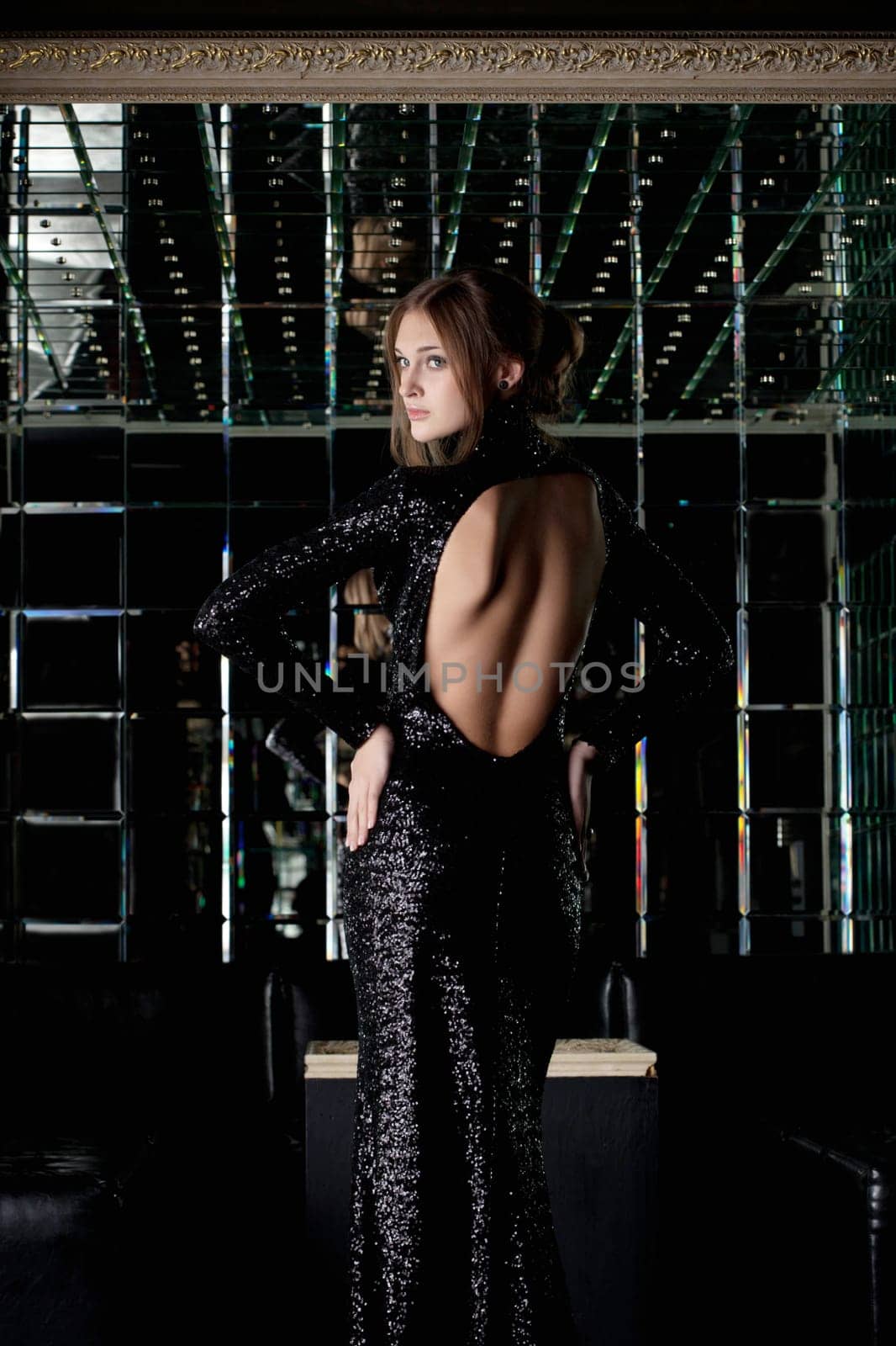 Portrait of beautiful woman in long black dress