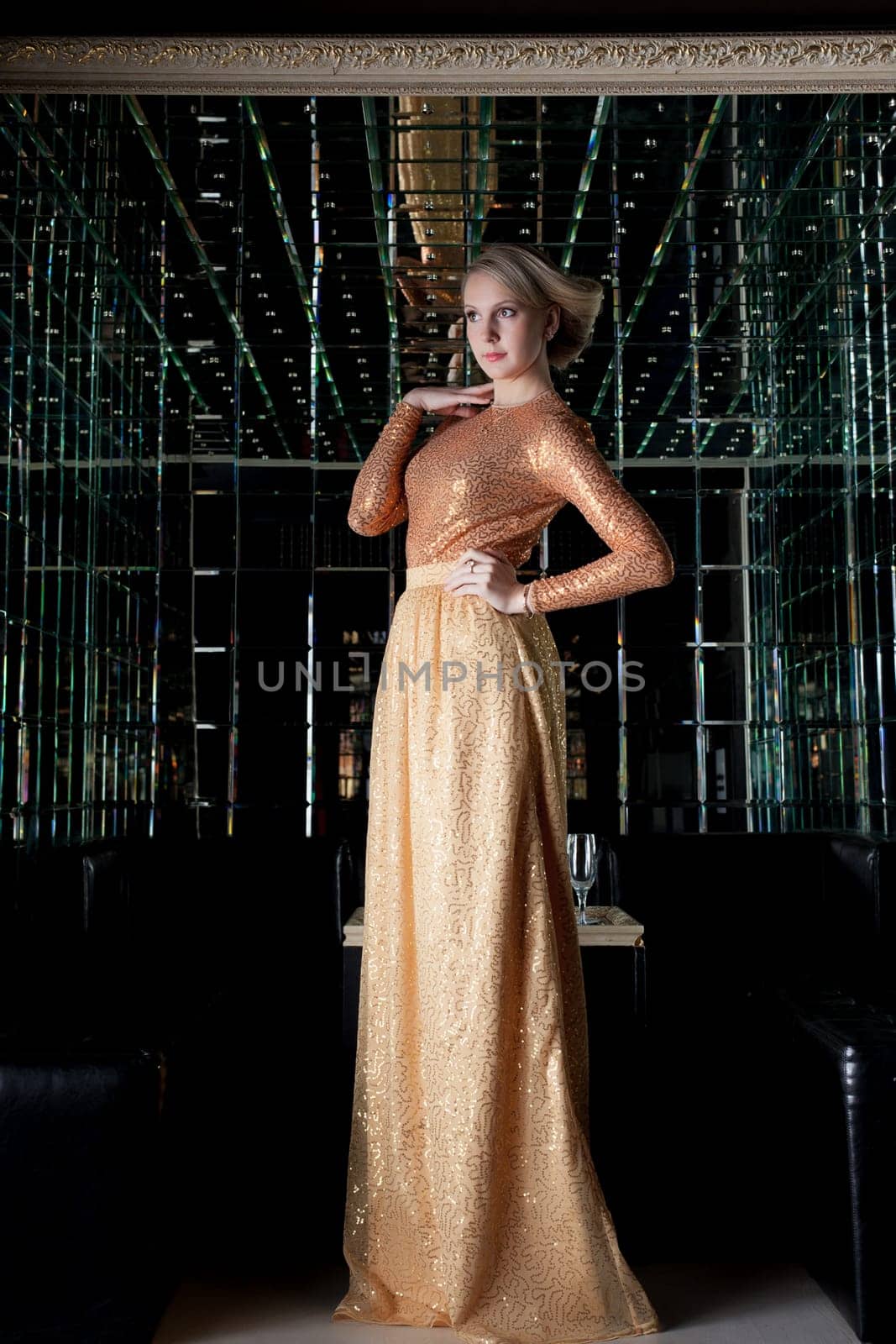 Full length portrait of woman with short hair in beautiful long dress