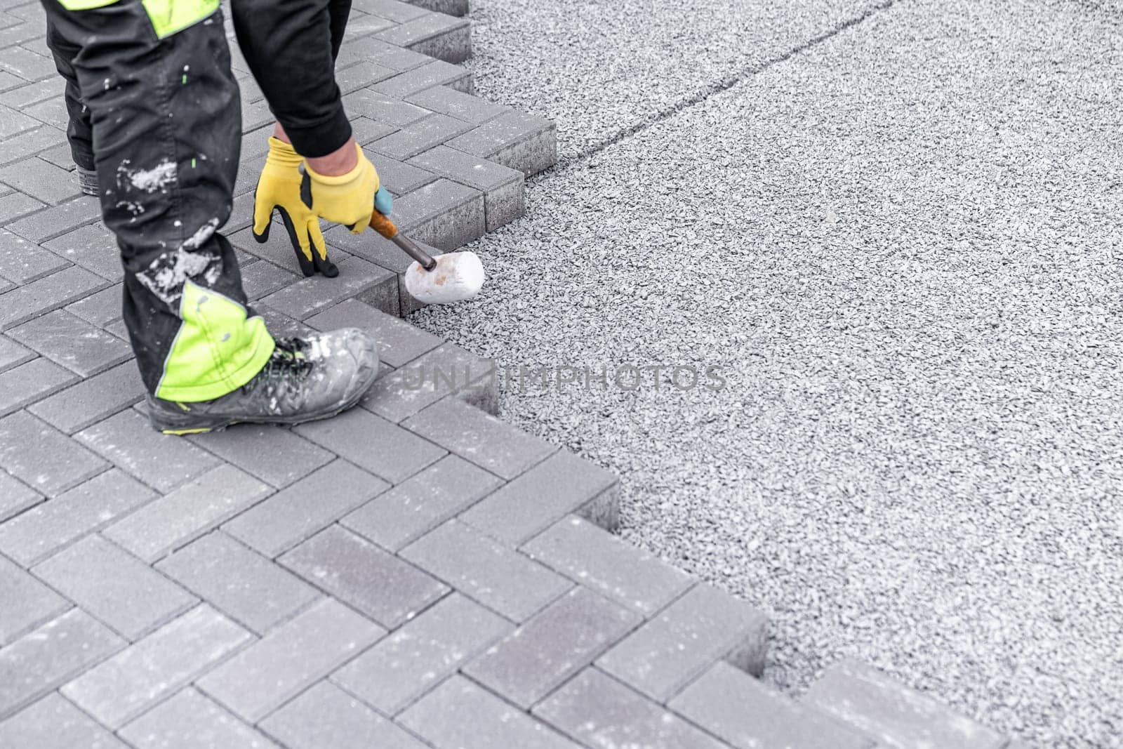 construction of a sidewalk from concrete blocks.