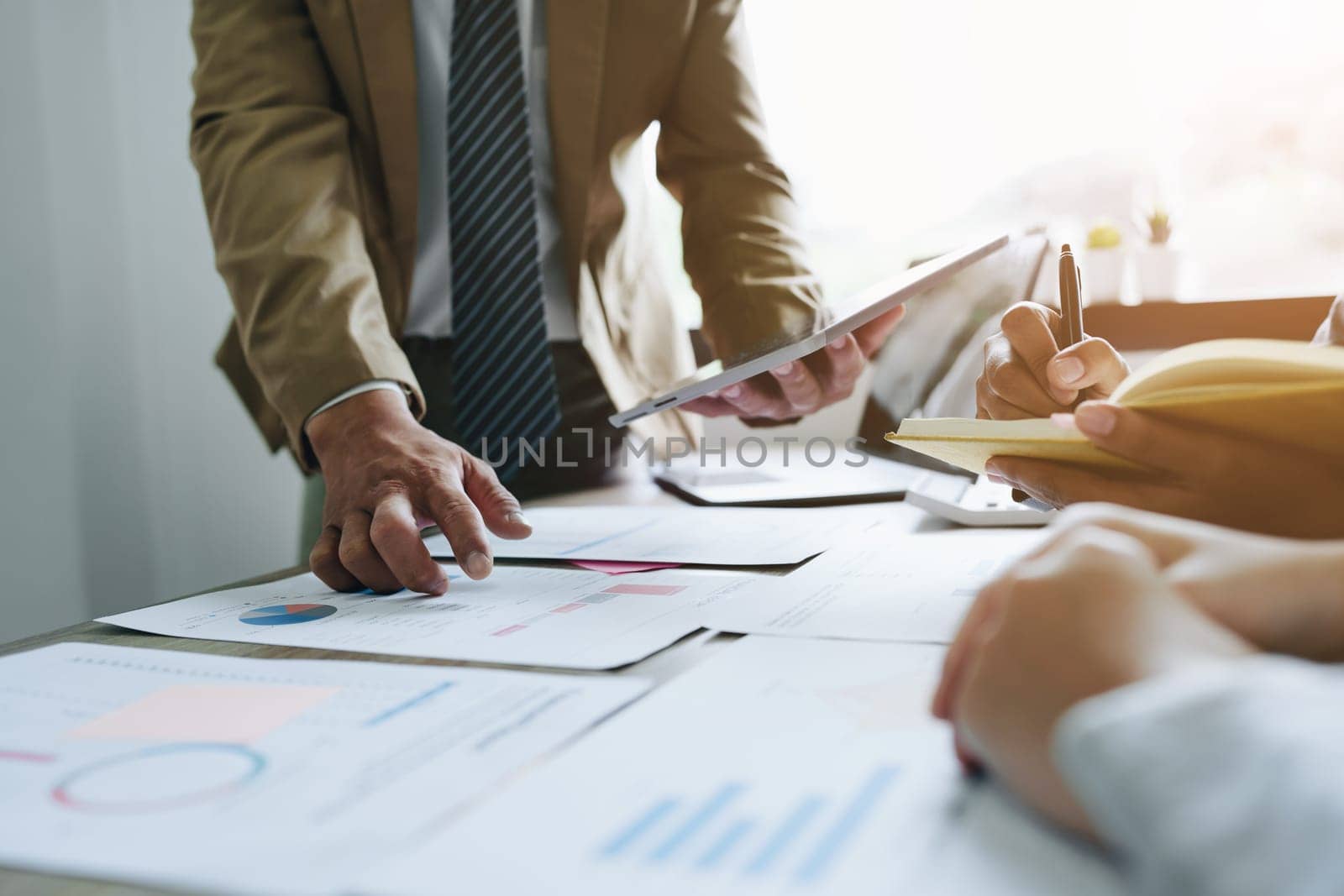 Asian entrepreneurs and business people meeting in a conference room in business planning, financial budget and investment risk assessment to analyze customer groups to increase company growth.