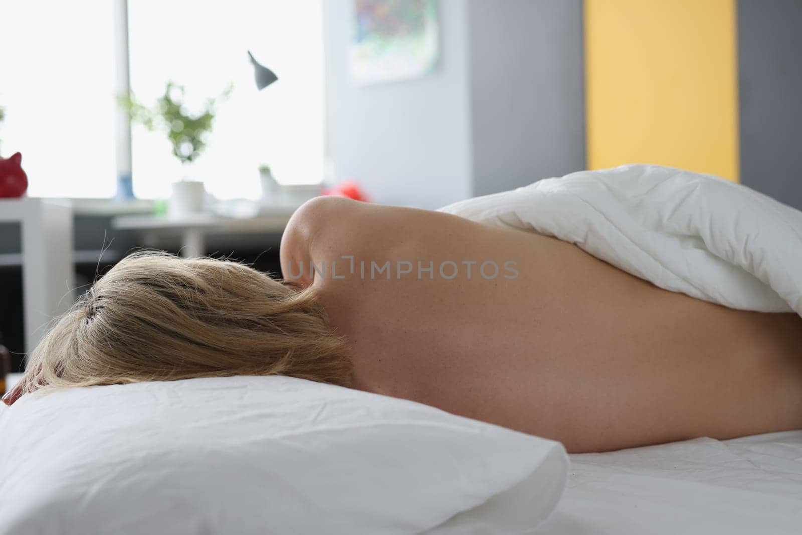 Sleeping nude woman on bed rear view by kuprevich