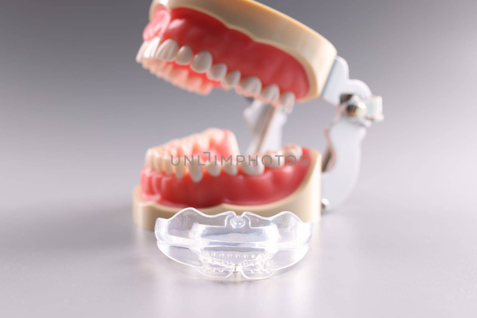 Silicone orthodontic retainers to hold teeth and artificial jaw. Orthodontics dental care for teeth alignment