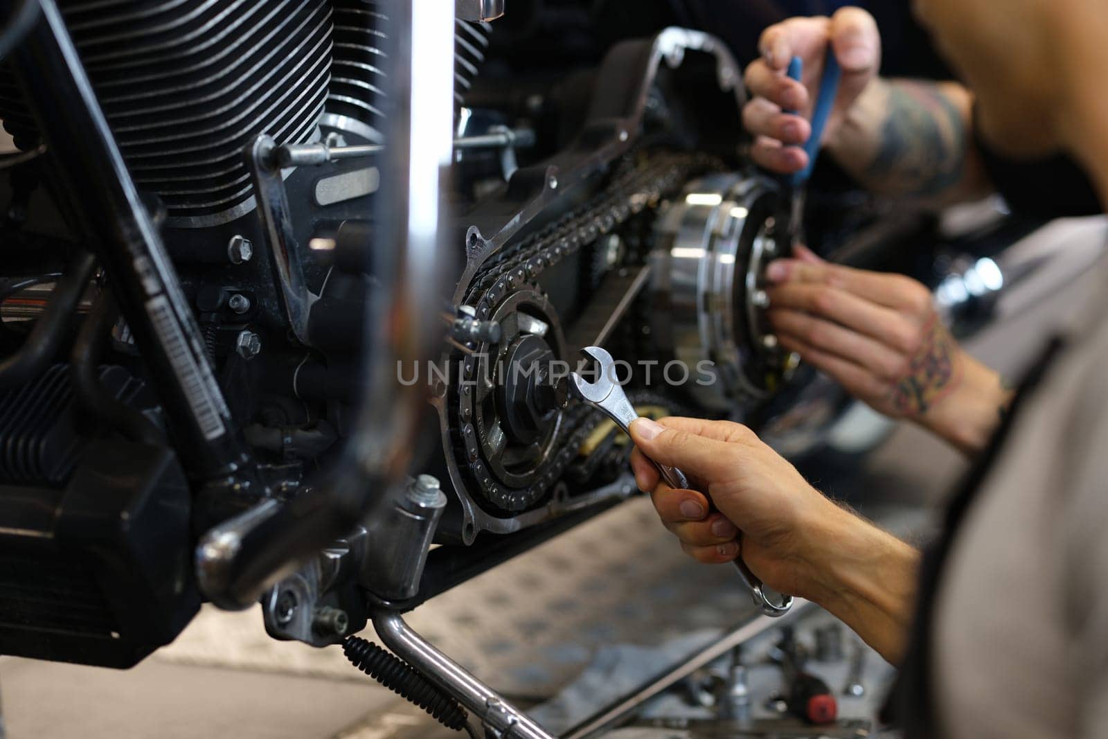 Maintenance of motorcycle engine clutch system by technicians by kuprevich
