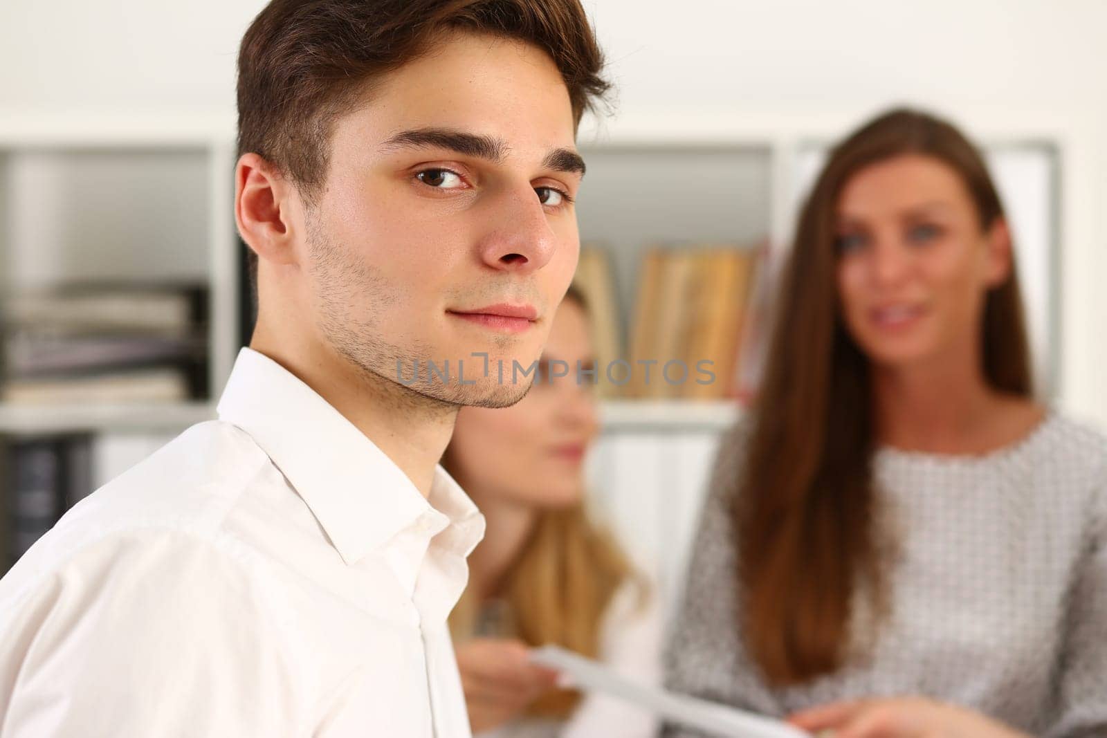 Portrait of young student intern at job interview or corporate training by kuprevich