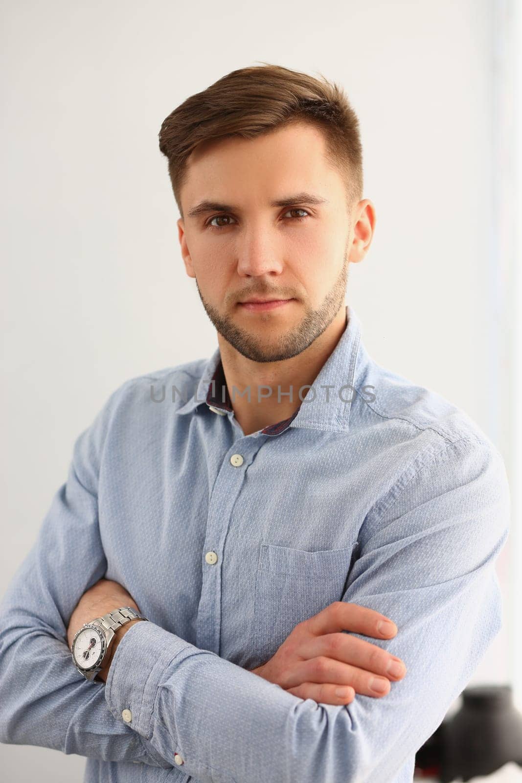 Portrait of handsome young attentive focused businessman in shirt. Business consultant manager or boss concept