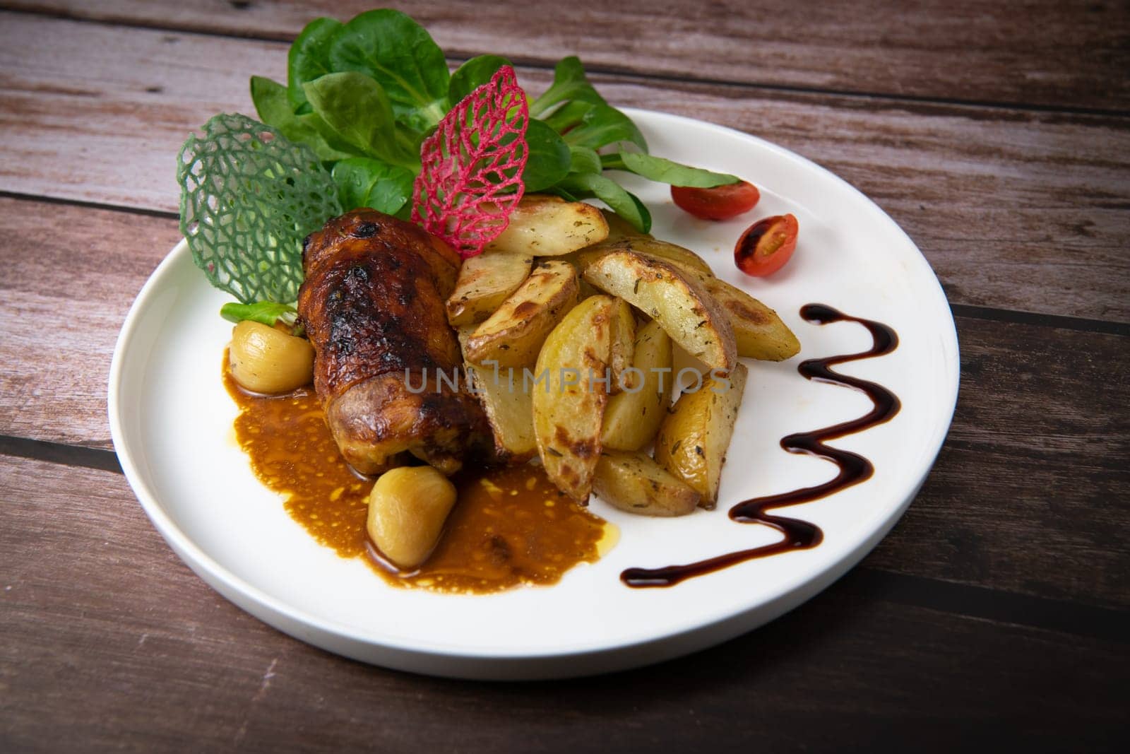 Recipe for boneless rolled chicken leg with potatoes and molasses-flavoured mache salad, High quality photo