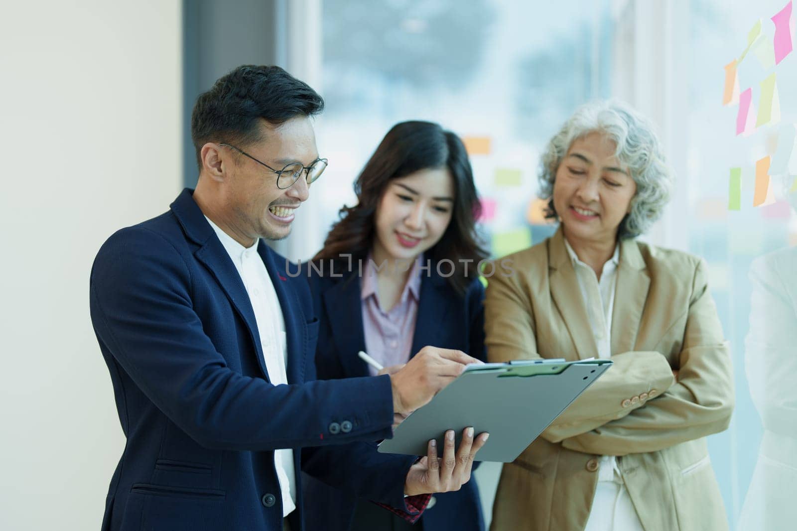 Asian entrepreneurs and business people meeting in a conference room in business planning, financial budget and investment risk assessment to analyze customer groups to increase company growth by Manastrong