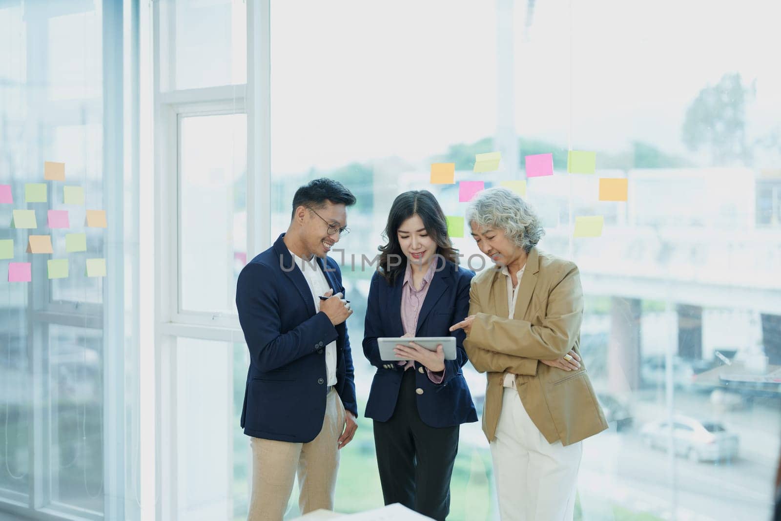 Asian entrepreneurs and business people meeting in a conference room in business planning, financial budget and investment risk assessment to analyze customer groups to increase company growth by Manastrong