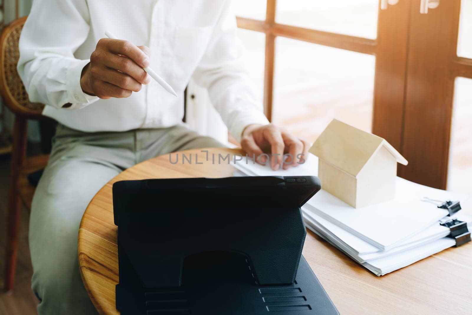 Asian entrepreneurs handshakes to congratulate the agreement between the two companies to enhance investment and financial strength. deal concept by Manastrong