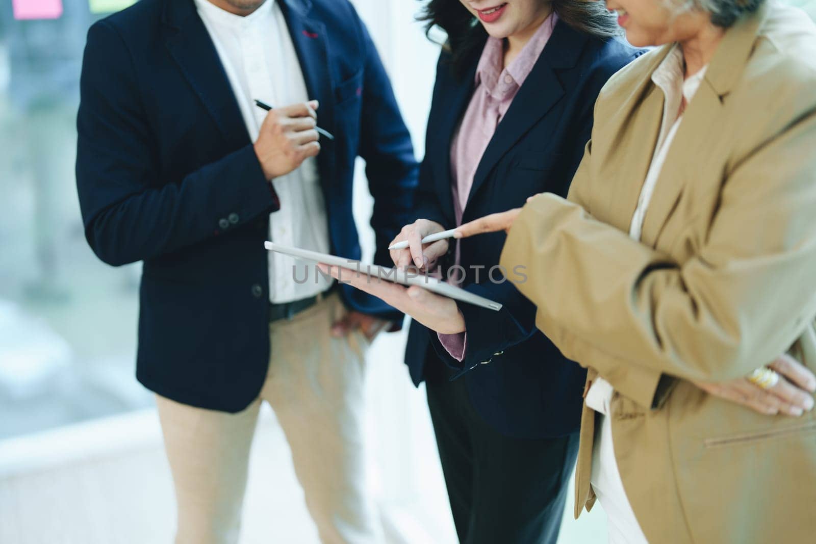 Asian entrepreneurs and business people meeting in a conference room in business planning, financial budget and investment risk assessment to analyze customer groups to increase company growth by Manastrong