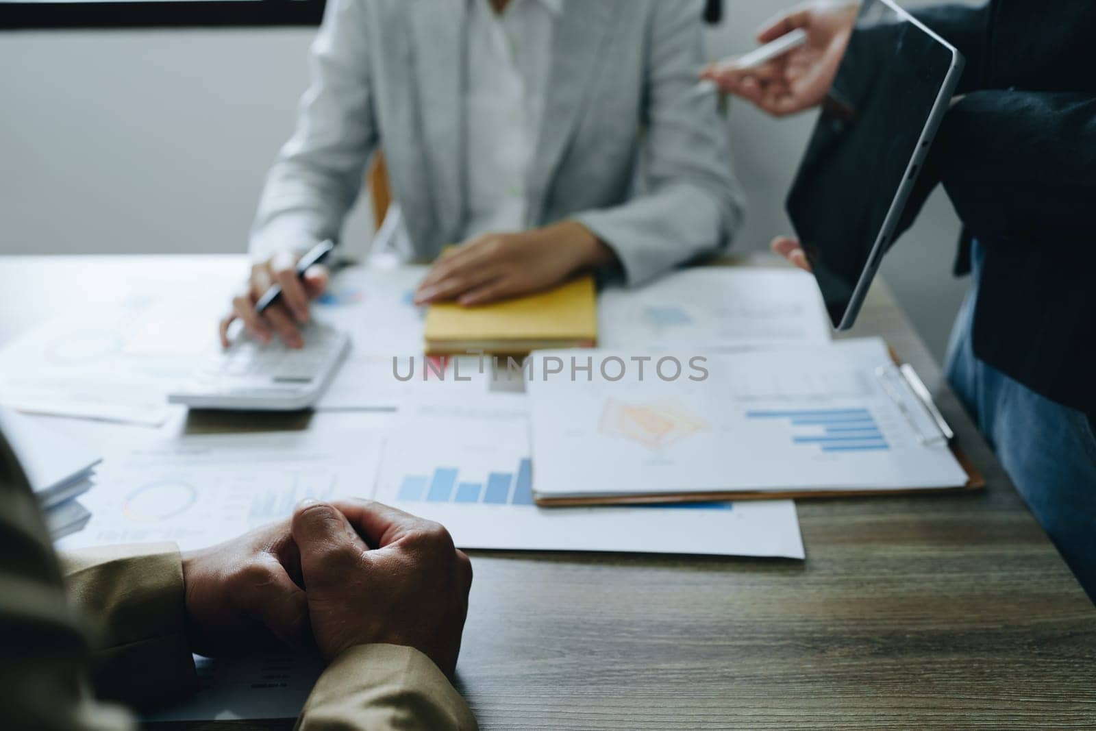 Asian entrepreneurs and business people meeting in a conference room in business planning, financial budget and investment risk assessment to analyze customer groups to increase company growth.