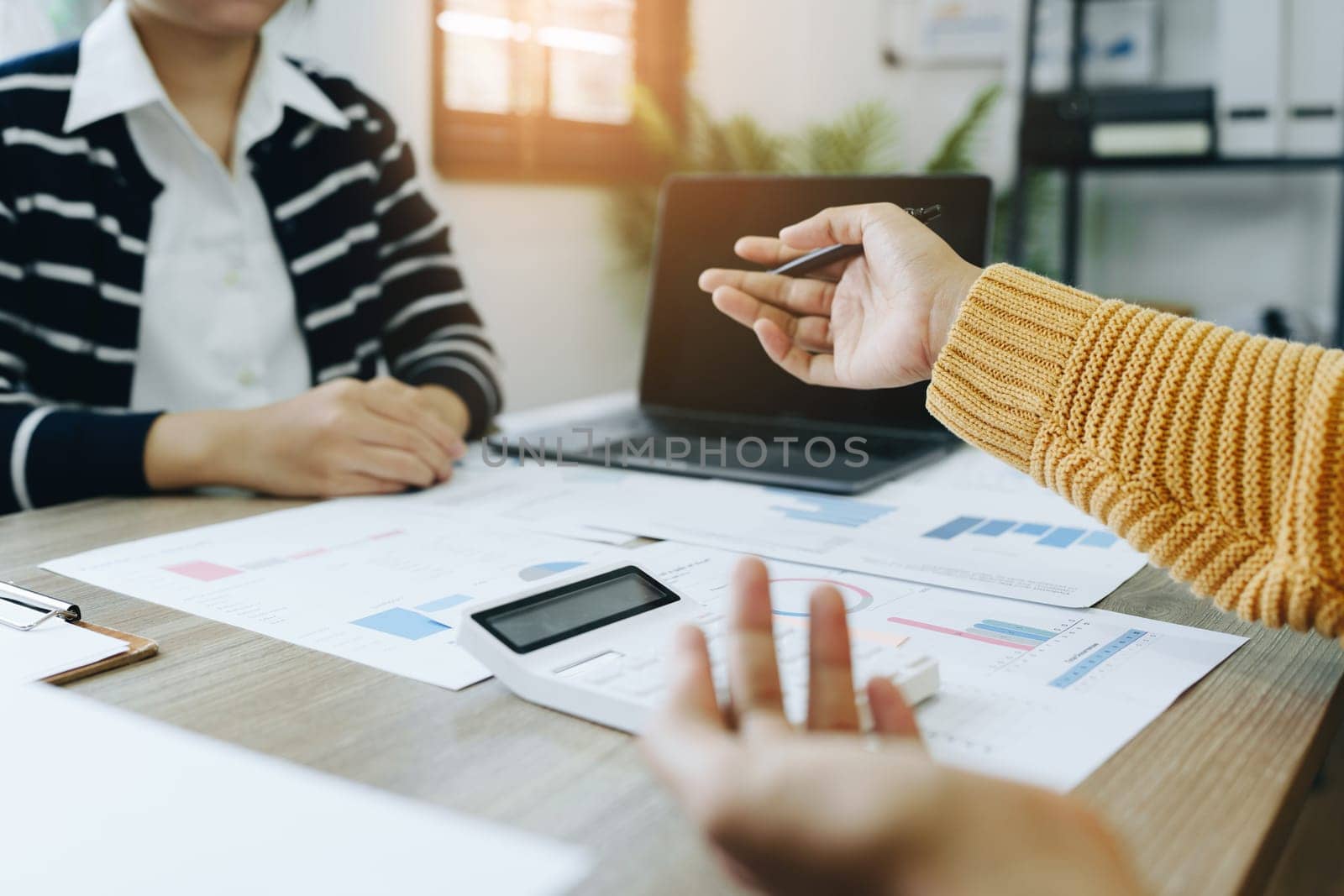 Asian entrepreneurs and business people meeting in a conference room in business planning, financial budget and investment risk assessment to analyze customer groups to increase company growth.