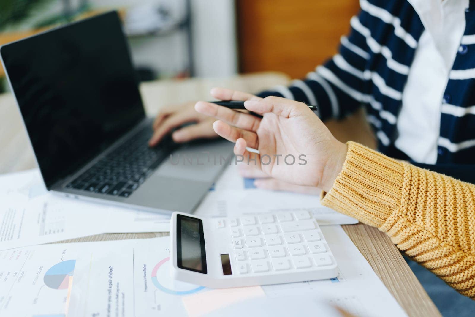 Asian entrepreneurs and business people meeting in a conference room in business planning, financial budget and investment risk assessment to analyze customer groups to increase company growth by Manastrong