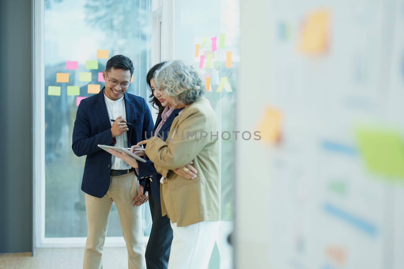 Asian entrepreneurs and business people meeting in a conference room in business planning, financial budget and investment risk assessment to analyze customer groups to increase company growth by Manastrong