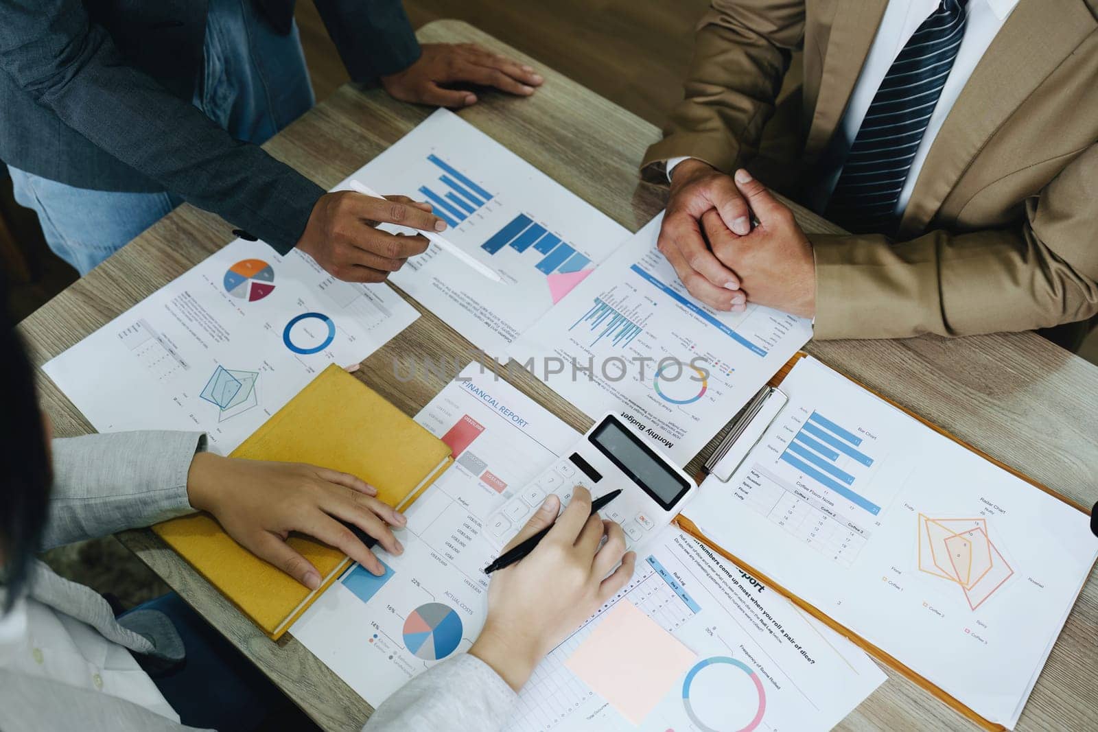 Asian entrepreneurs and business people meeting in a conference room in business planning, financial budget and investment risk assessment to analyze customer groups to increase company growth.