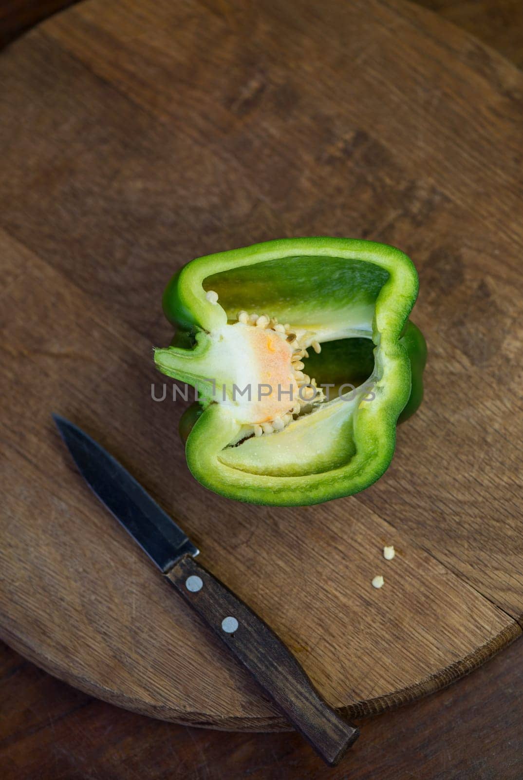 sweet pepper, green bell pepper on wooden board , full depth of field by aprilphoto