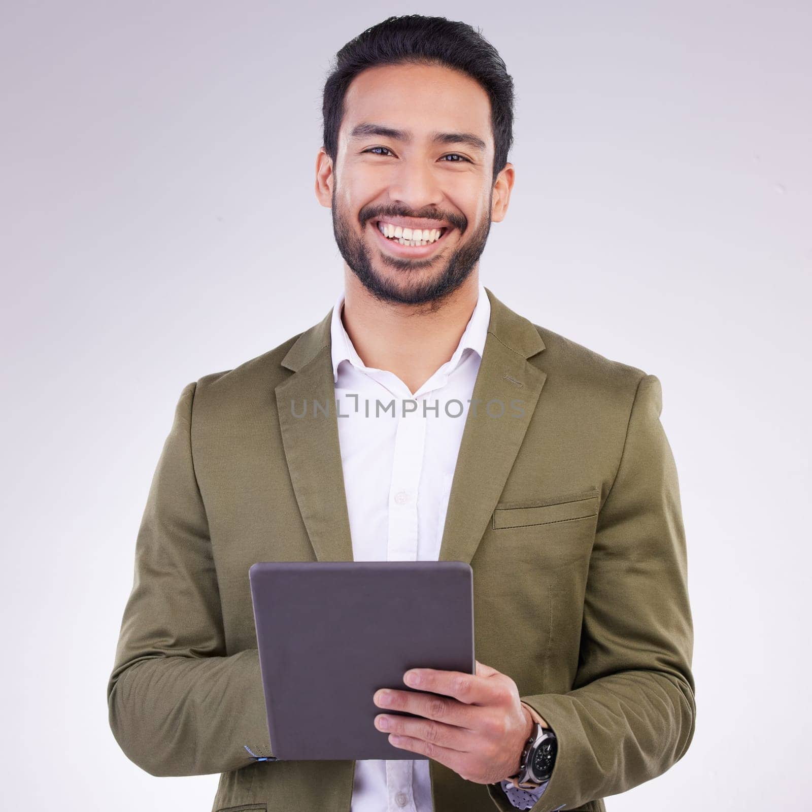 Business man, tablet and smile portrait in studio for internet, communication and network connection. Entrepreneur male online for mobile app networking, marketing or research on investment or sales by YuriArcurs