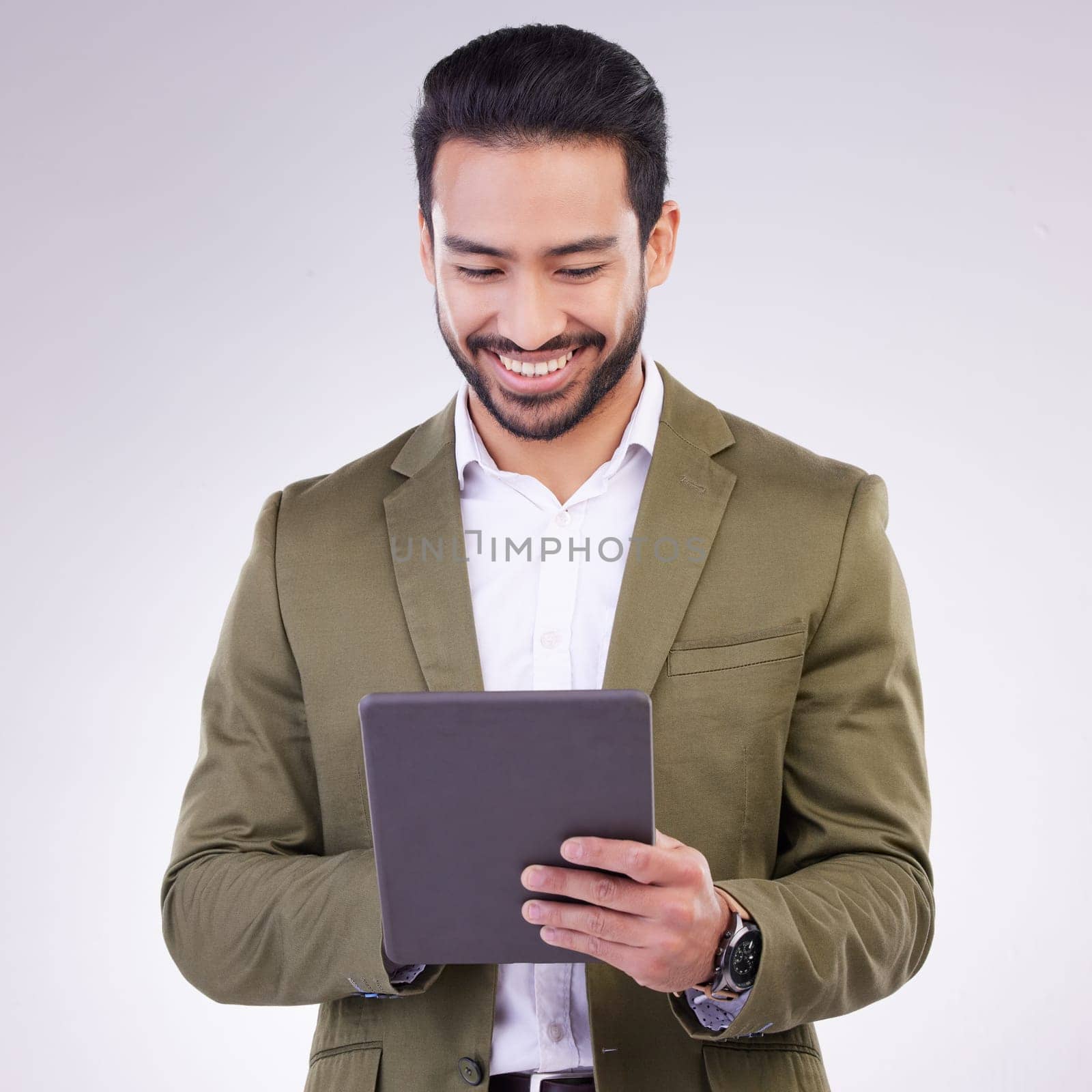Business man, tablet and smile in studio for internet, communication and network connection. Entrepreneur male online for mobile app networking, social media or research on investment or sales.