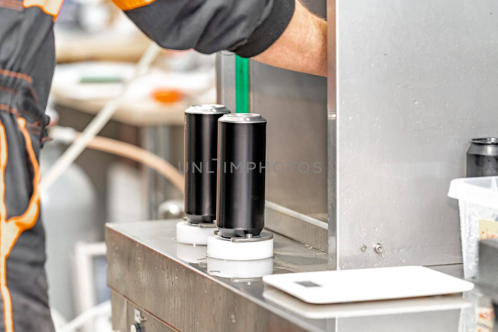 beer filled beverage cans in a brewery.