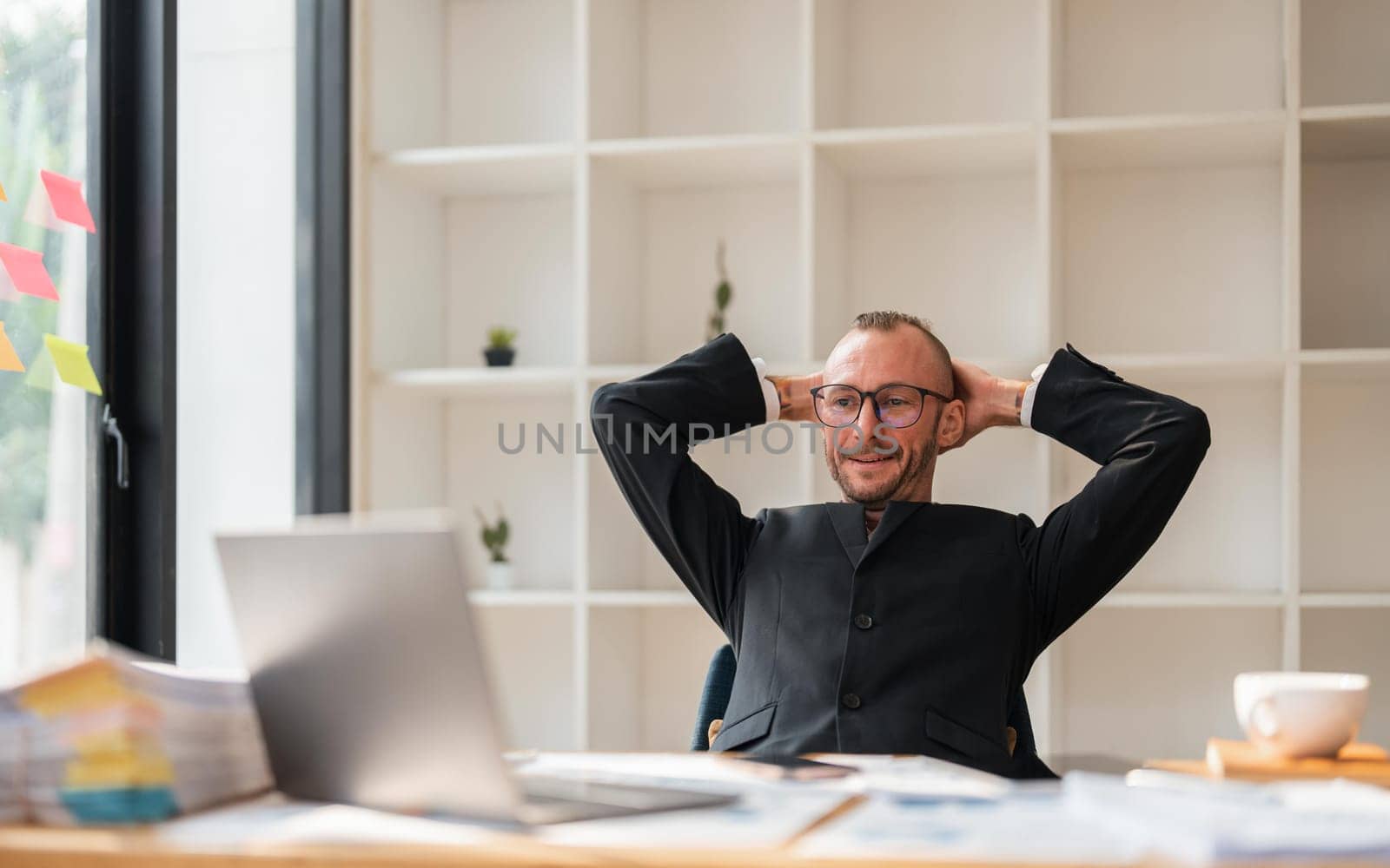 Relaxed business man take break from work put hands behind head lean on comfy chair feels serenity, enjoy fresh conditioned air in office by nateemee