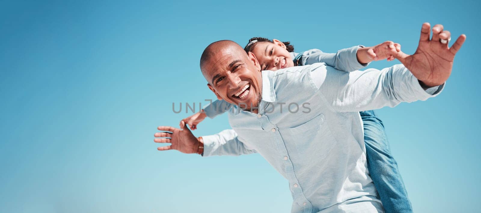 Portrait, father and kid piggyback on blue sky of summer vacation, holiday and freedom on mockup space. Below of happy family, dad and flying girl child in excited game, smile and support adventure.