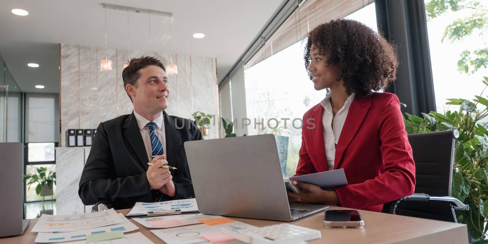 Business financial, accountant discussing with partner are meeting to audit finance planning sales to meet targets set in next year. stock market concept....