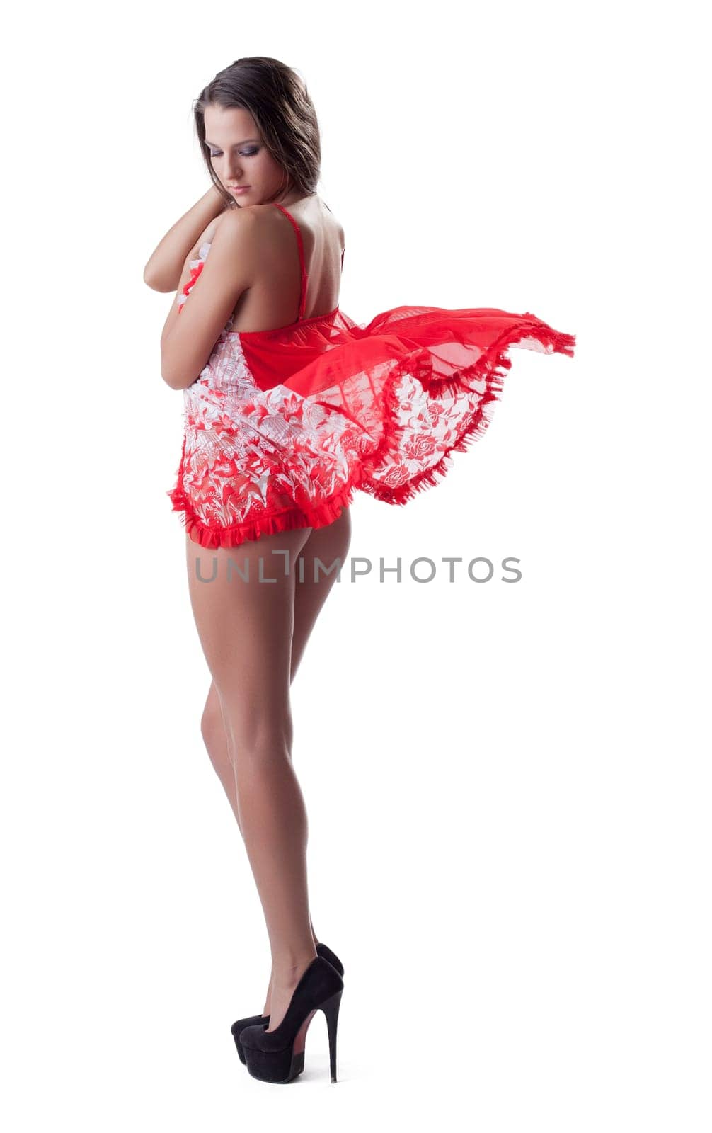 Beautiful young woman in sexy lingerie and shoes. Isolated on white