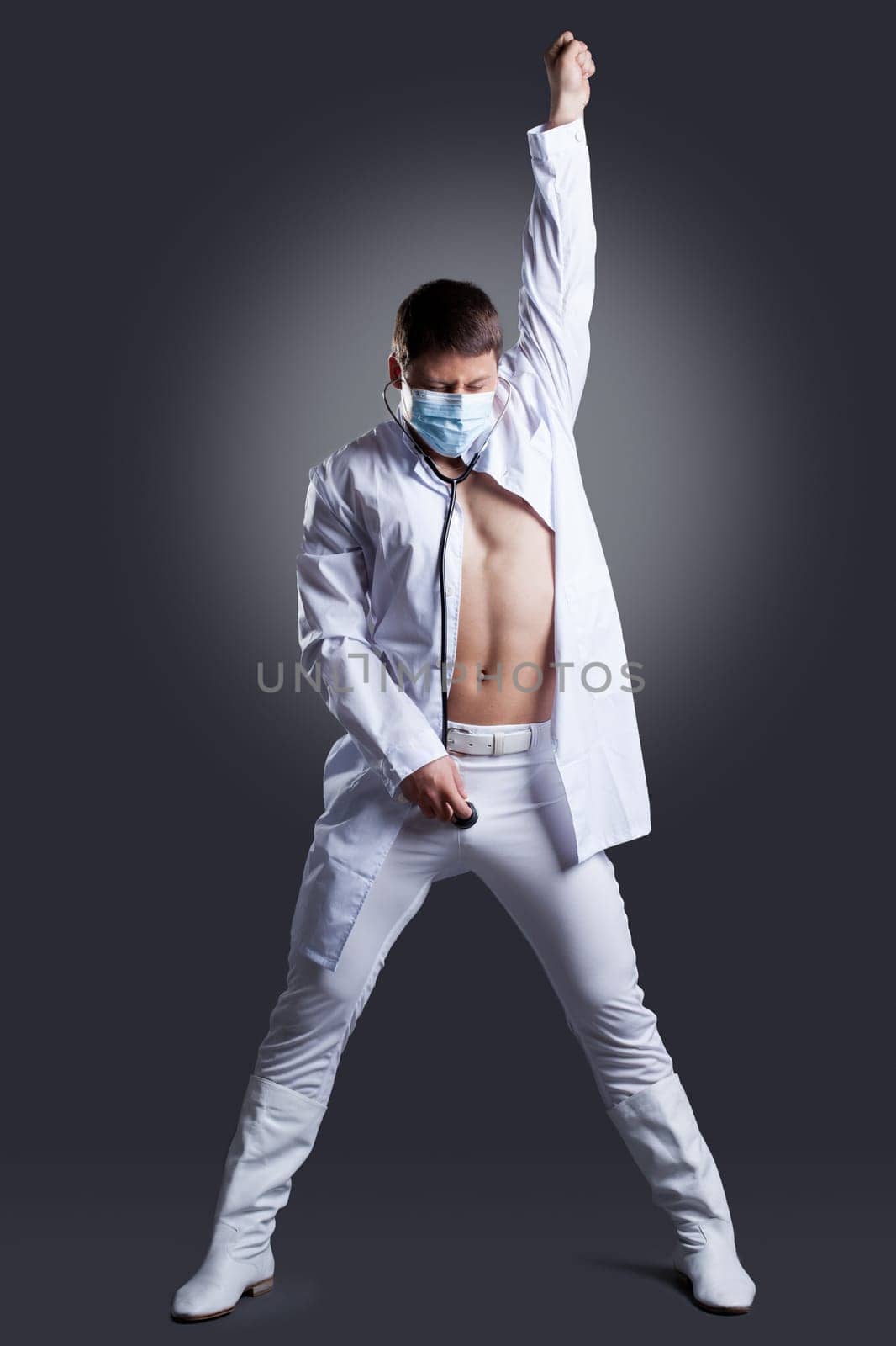 Dancer in white doctor costume. Studio portrait