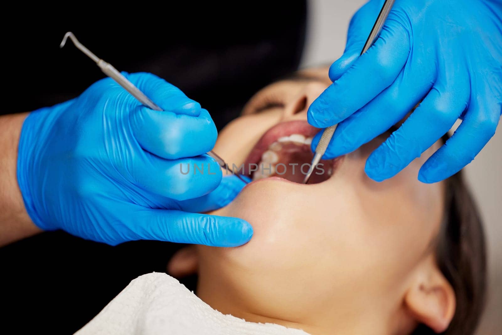 Change your smile, change your life. a young woman having a dental procedure performed on her