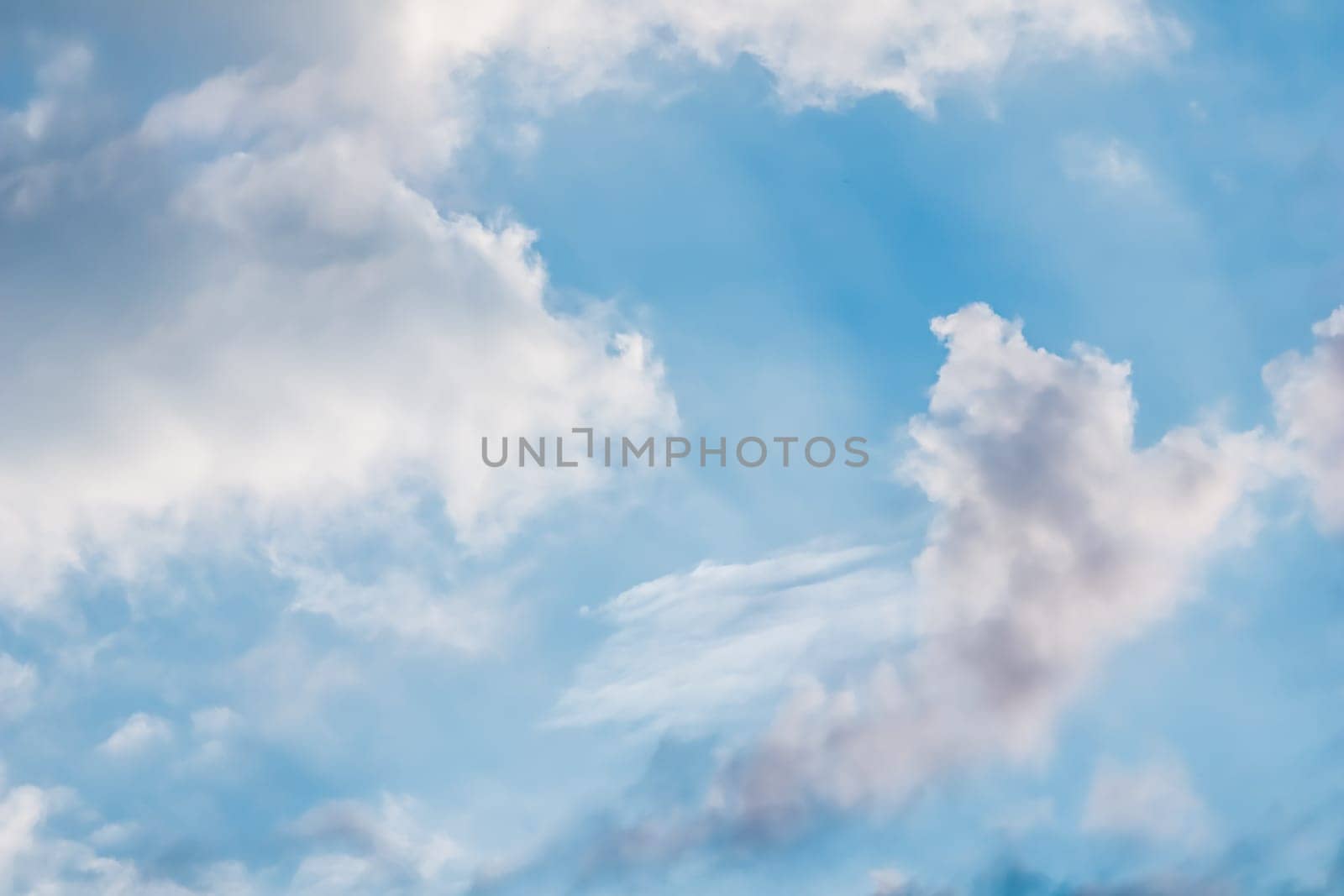 Background of blue sky with white clouds by Olayola