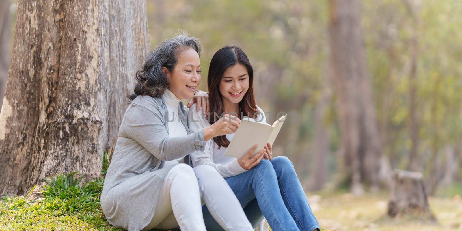 Adult daughter and her elderly mother have outdoor activity together.