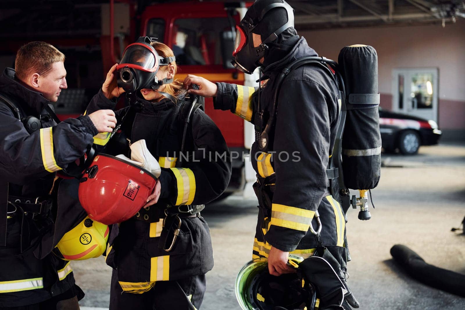 Group of firefighters in protective uniform that is on station.