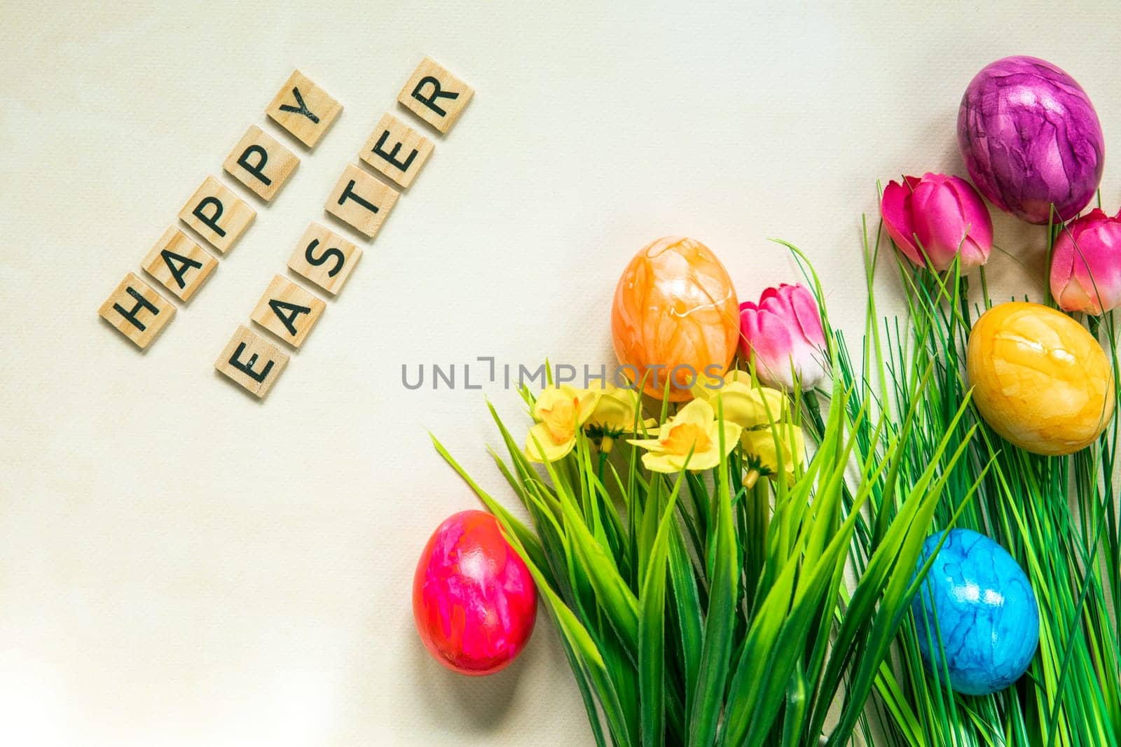 Happy Easter text with colorful paineted easter eggs in fresh green grass, Animation, colorful Easter eggs and text on a light background. Video for presentation of Happy Easter. top view