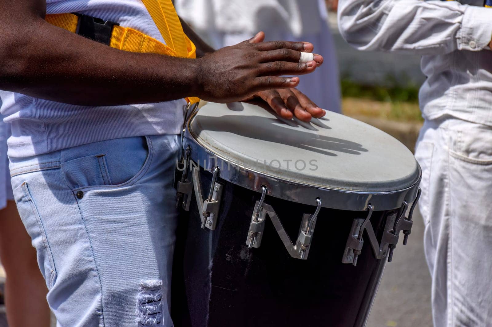 Atabaque drum player in the streets of Brazil during brazilian samba presentation