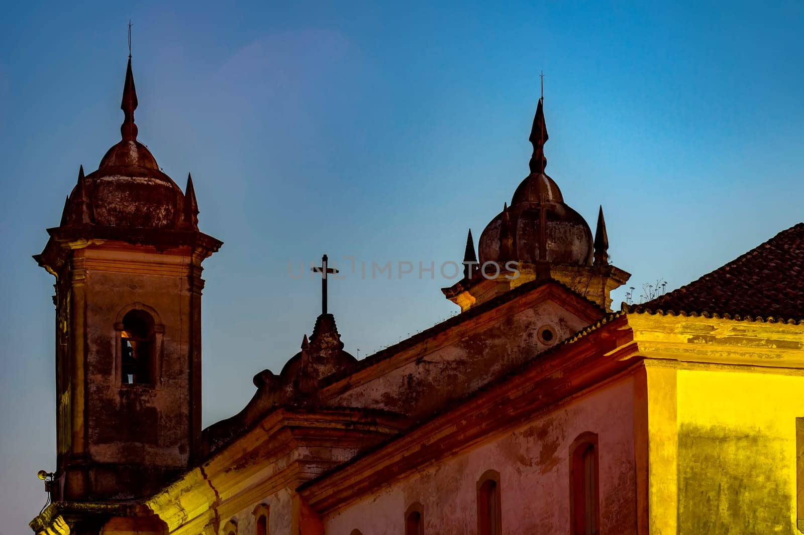 Back view at night of old and historic church in colonial architecture from the 18th century in the city of Ouro Preto in Minas Gerais, Brazil