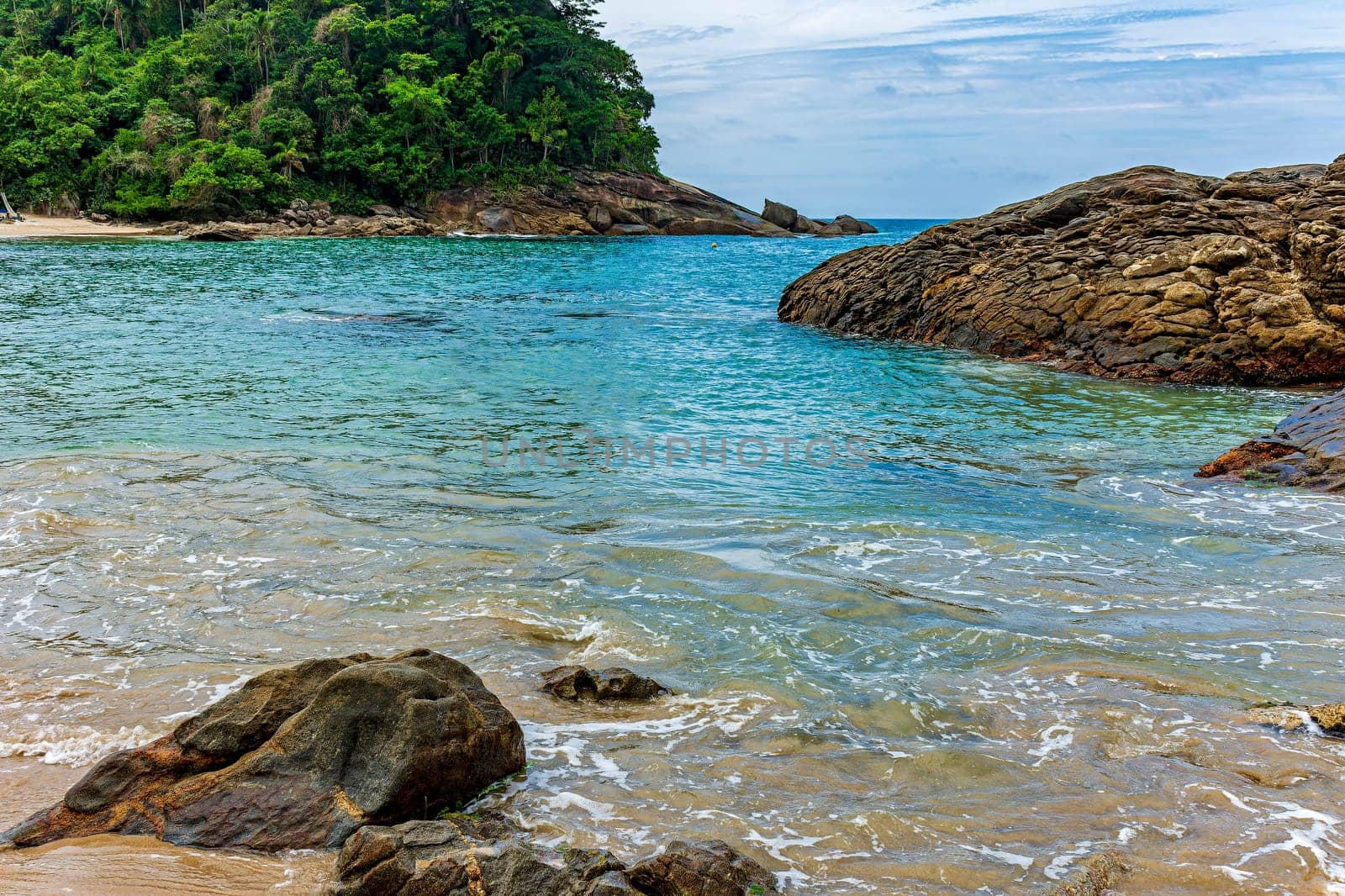 Beach surrounded by rainforest of the tropical paradise of Trindade in Paraty on the coast of Rio de Janeiro