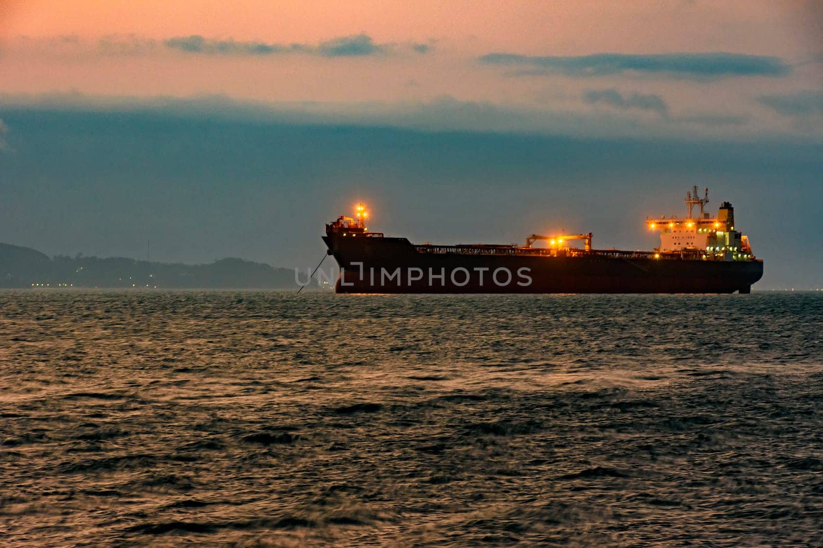Cargo ship anchored in the waters of Ilhabela by Fred_Pinheiro