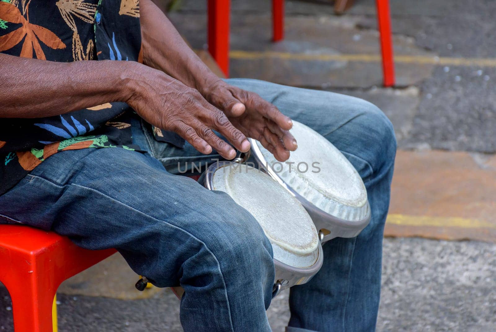 Bongos drum player in the streets of Salvador city during brazilian samba presentation