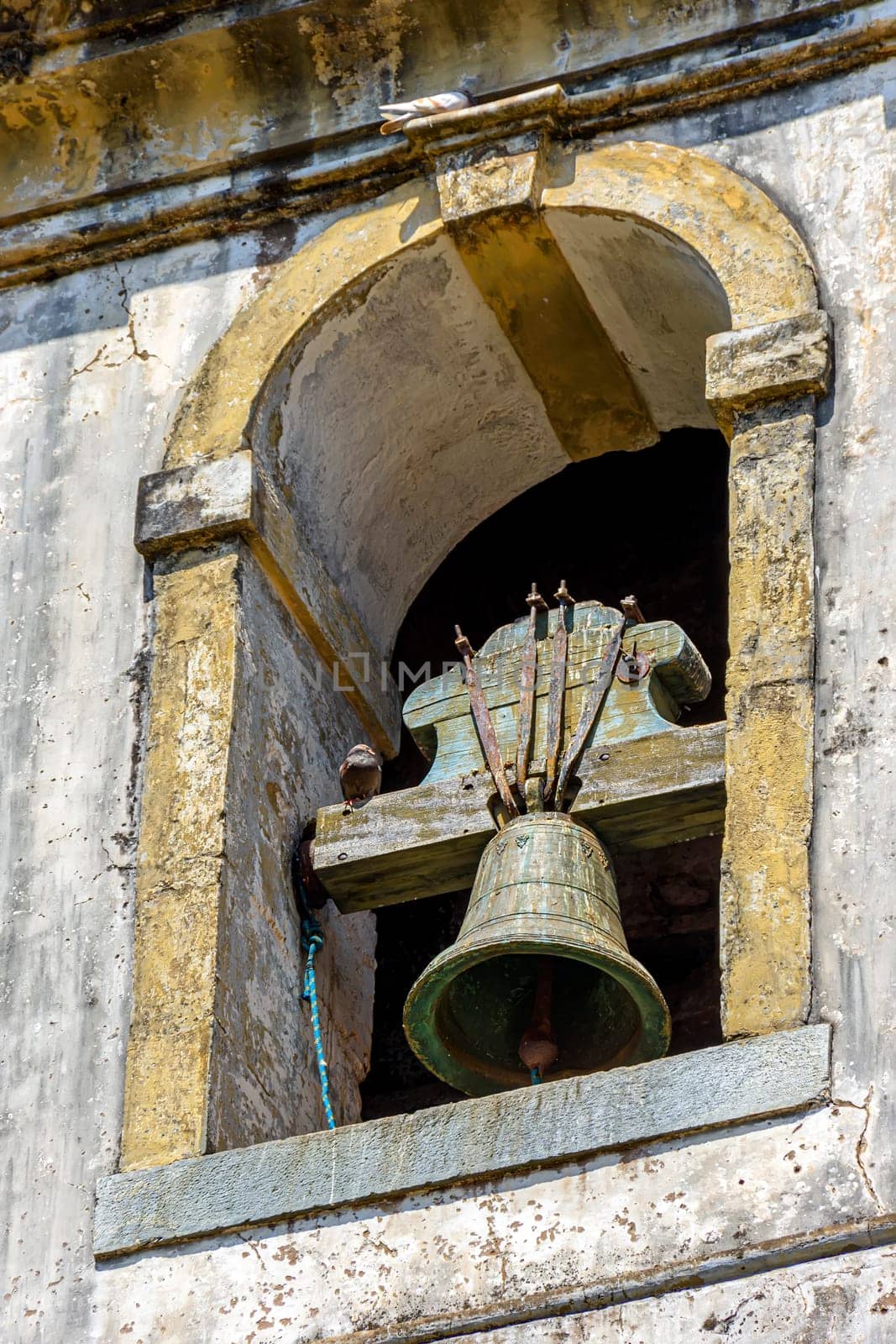 Colonial-style church tower with old bell by Fred_Pinheiro