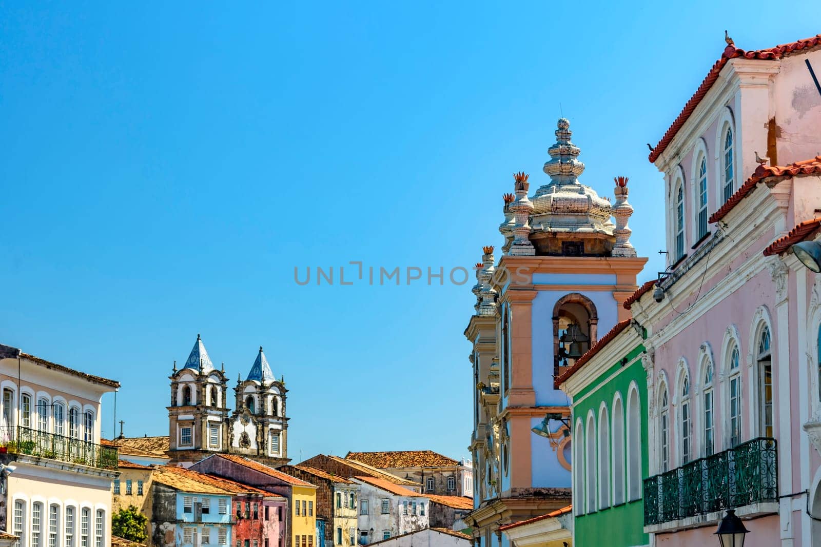 Colorful facades and historic church towers in baroque and colonial style in the famous Pelourinho neighborhood of Salvador, Bahia