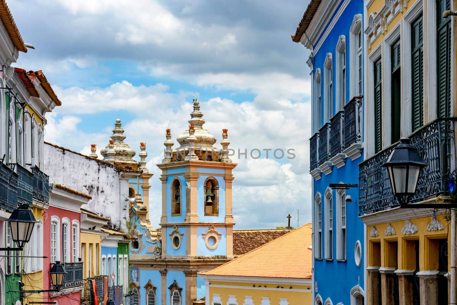 Colorful facades of old houses and historic church in Pelourinho neighborhood in Salvador city, Bahia