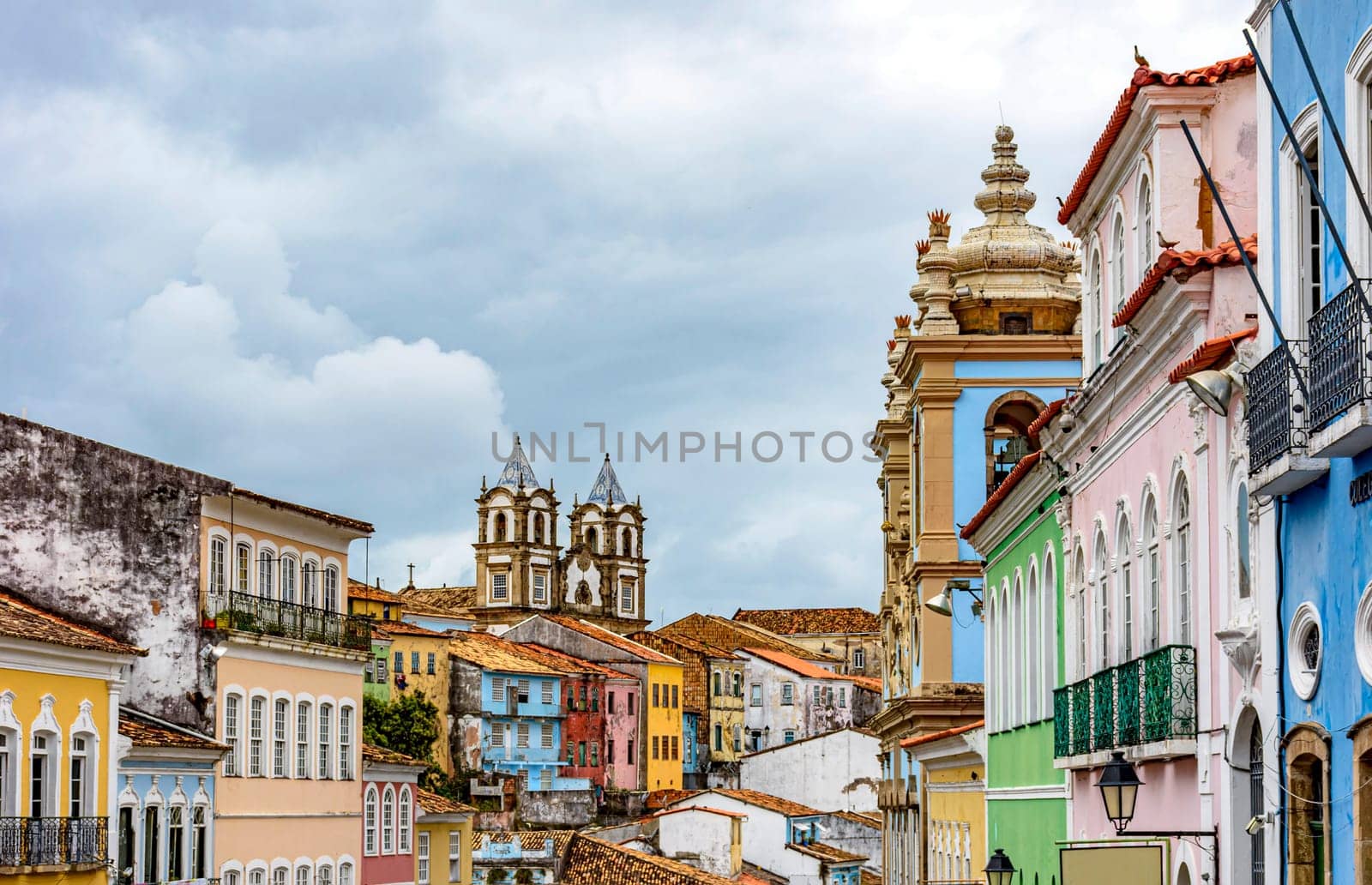 Colorful historical colonial houses facades and antique church towers in baroque and colonial style in the famous Pelourinho district of Salvador, Bahia