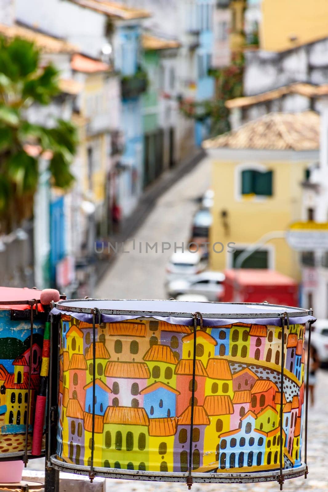 Decorated drums with the streets and slopes of the famous and historic Pelourinho district in Salvador in the background